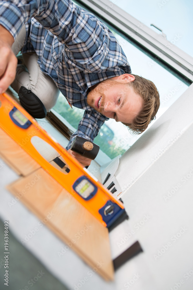 man checking the level of the floor