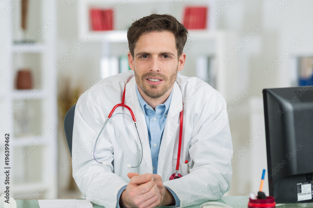portrait of smiling young male doctor