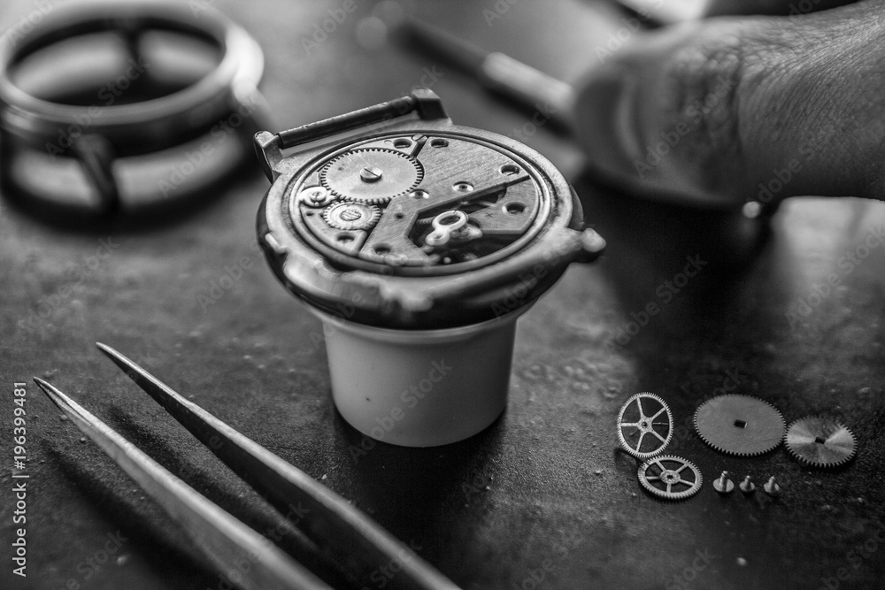 Watchmaker is repairing the mechanical watches in his workshop Watchmaker is repairing the mechanical watches in his workshop