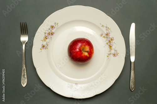 Close up image of red apple on the plate