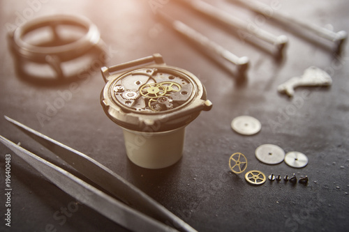 Watchmaker is repairing the mechanical watches in his workshop