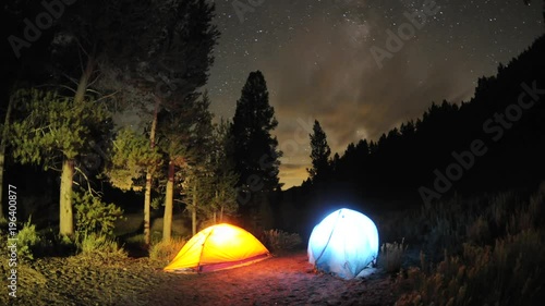 Day to night time lapse setting up two tents below the milky way and stars in Big Meadow, Sequoia National Forest, California.