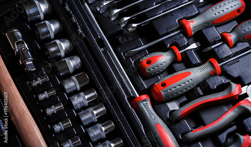 set of hand various work tools on grey background top view including different kinds of wrenches, pliers, clamps, calipers and other