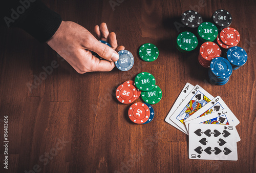 Person showing her deck at the poker game