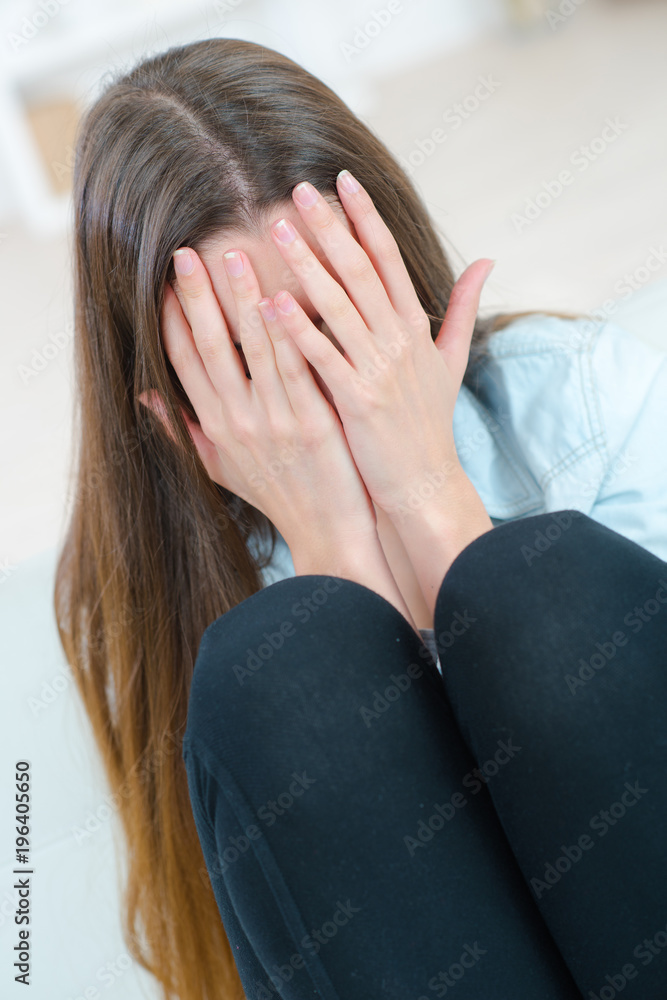 closeup depressed woman leaning head on hands closeup depressed woman leaning head on hands