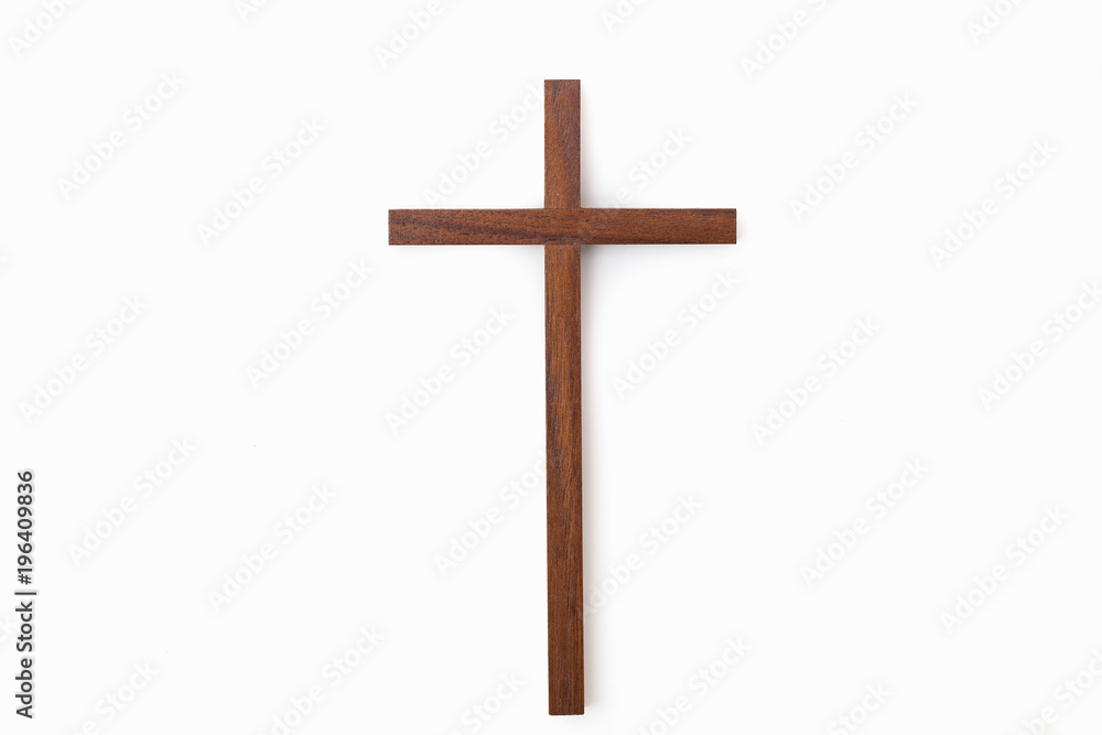 A studio shot of a small wooden cross 
