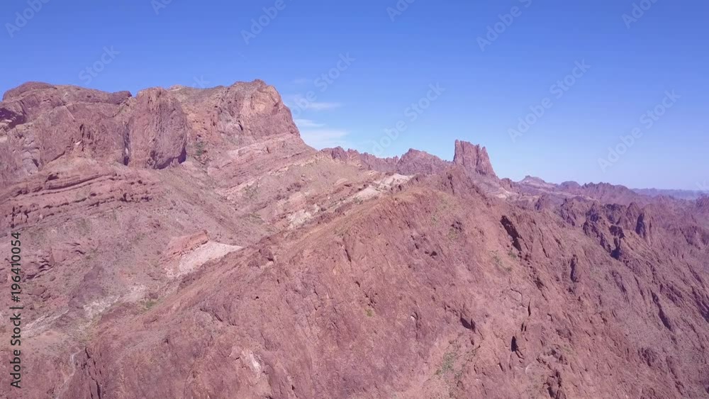 An aerial over the barren and high peaks of the Sonoran Desert in Arizona. An aerial over the barren and high peaks of the Sonoran Desert in Arizona.