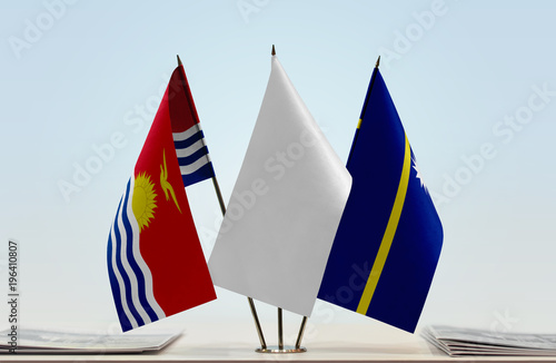 Flags of Kiribati and Nauru with a white flag in the middle photo