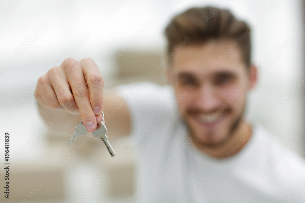 closeup.man showing keys of new apartments closeup.man showing keys of new apartments