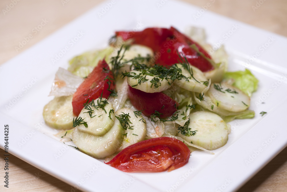 Fresh vegetable salad and bread on a table