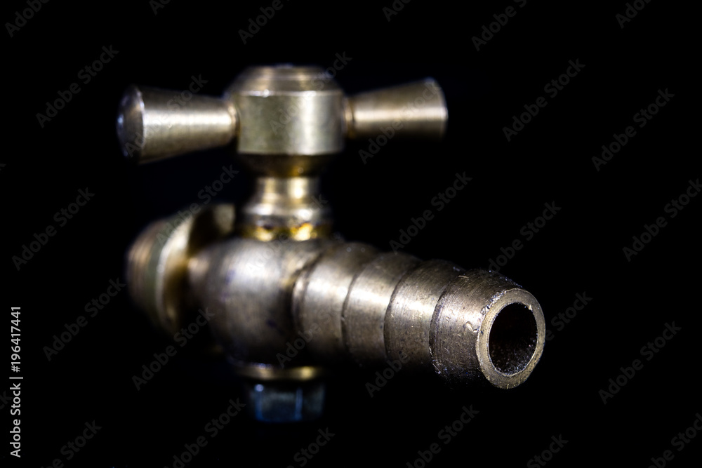 Old hydraulic valve. Garden accessories for watering vegetation.