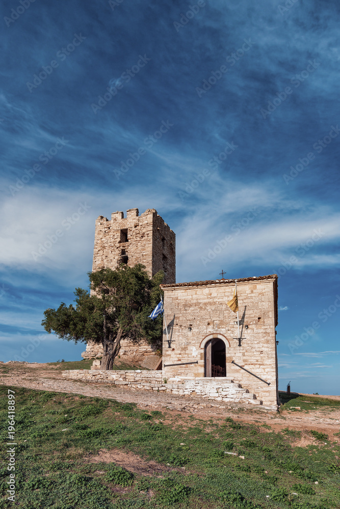 Byzantine tower, Nea Fokea, Kassandra, Greece. Beautiful Byzantine tower at sunset, Kassandra, Greece. Byzantine tower, Nea Fokea, Kassandra, Greece. Beautiful Byzantine tower at sunset, Kassandra, Greece.