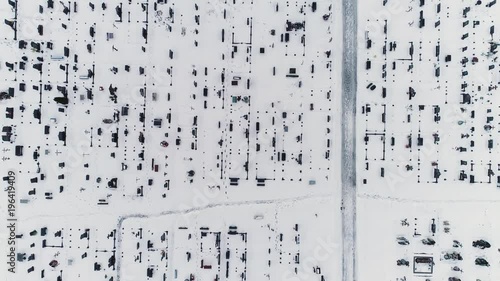 Aerial drone footage. Flight over cemetery in winter. Top view