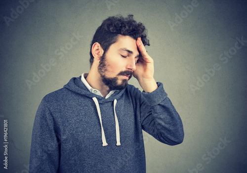 Photos Stressed sad man rubbing forehead