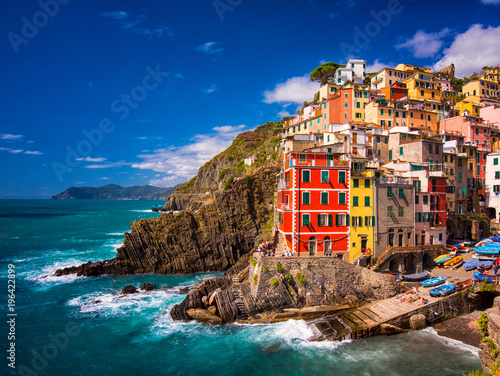 View on the colorful houses along the coastline of Cinque Terre area in Riomaggiore