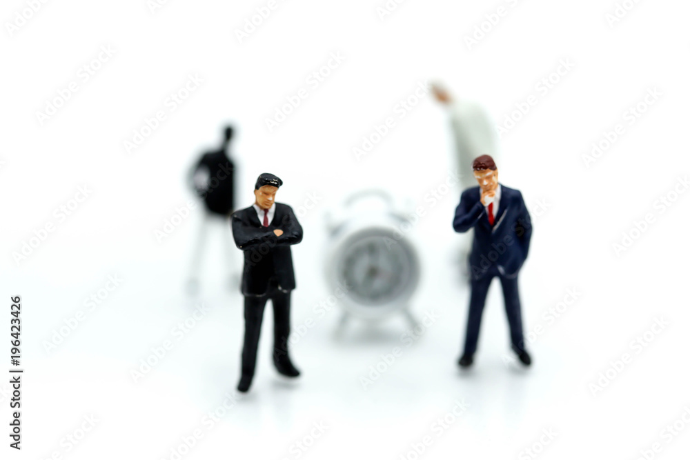Miniature people : Businessman stand with Clock,Business and time concept. Miniature people : Businessman stand with Clock,Business and time concept.
