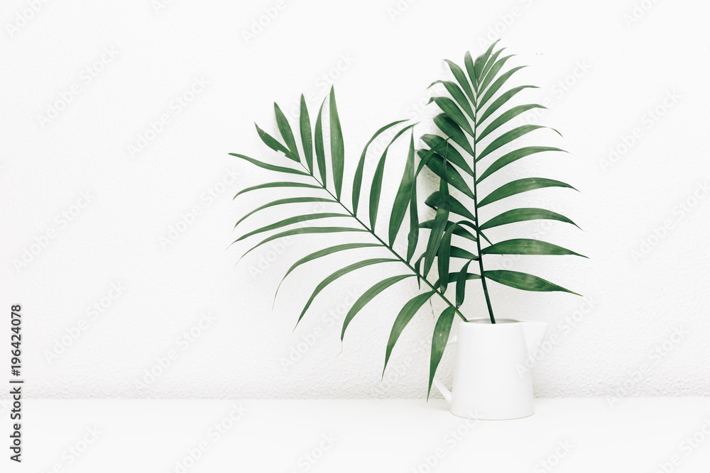 Minimal empty space, stylish hipster background with green tropical leaves in jar - obrazy, fototapety, plakaty 