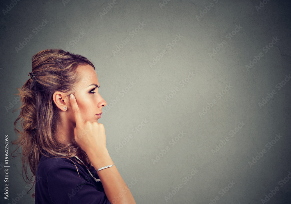 Pensive woman looking for solution - obrazy, fototapety, plakaty 
