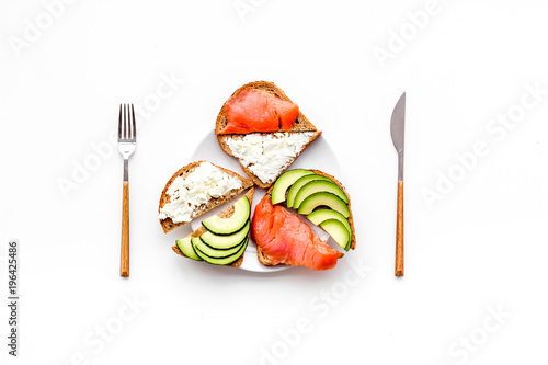 Healthy lunch with mini sandwiches on white background top view space for text