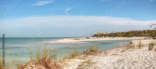 White sand beach and aqua blue water of Clam Pass in Naples, Florida