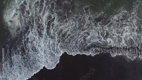 Beautiful straight down aerial over ocean waves.