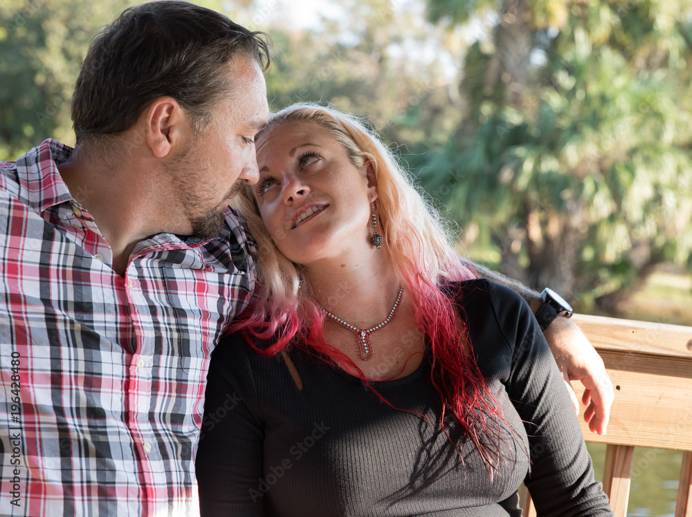 man watches womans lips move as she speaks man watches womans lips move as she speaks