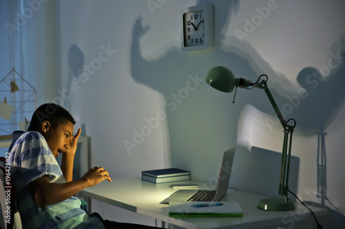 Scared African American boy...