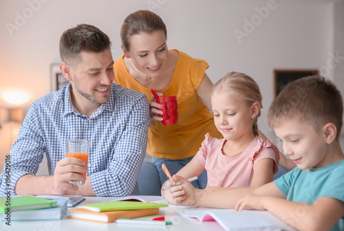 Little children with parent...