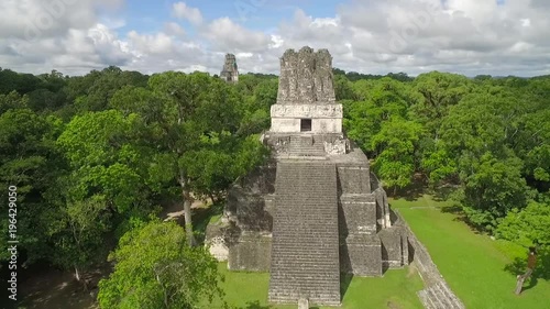 Spectacular aerial shot over the Tikal pyramids in Guatemala.