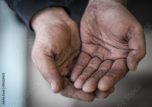 Poor man begging for money, closeup