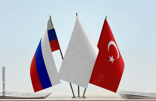 Flags of Russia and Turkey with a white flag in the middle