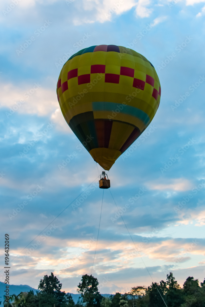Hot air balloon in flight. It is a type of aircraft that can lifted by heating the air inside the balloon, usually with fire.