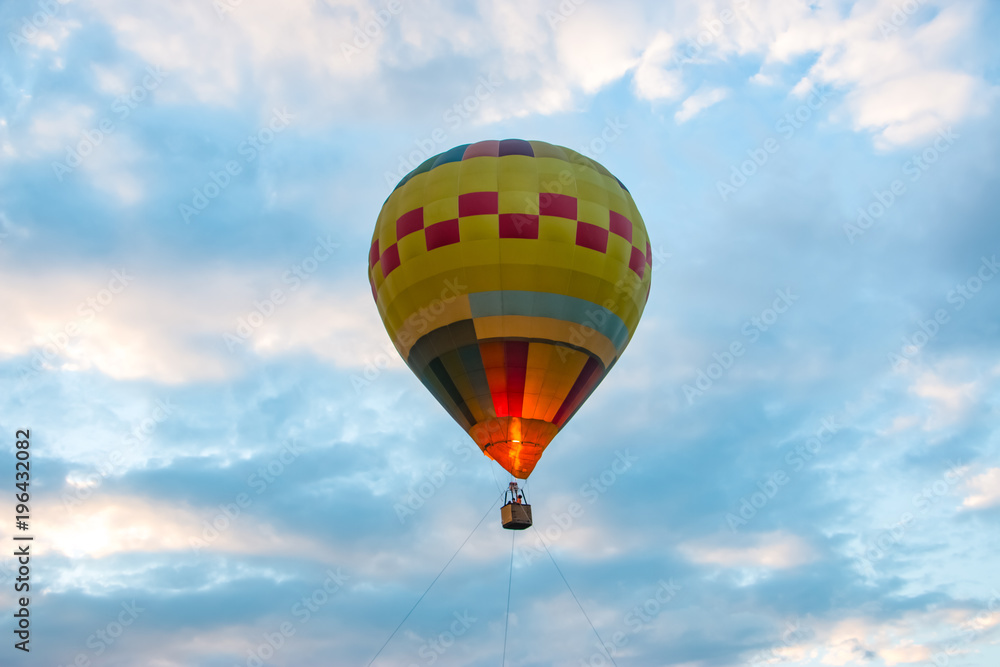 Naklejka premium Hot air balloon in flight. It is a type of aircraft that can lifted by heating the air inside the balloon, usually with fire.