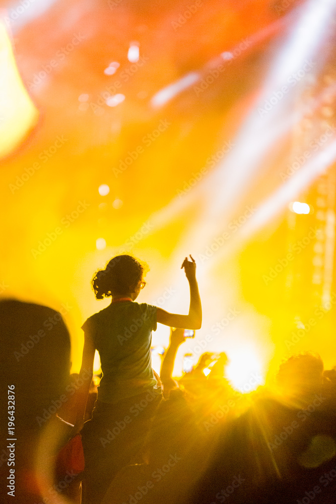 Young girl enjoying a live concert