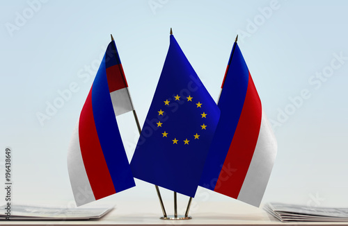 Two flags of Lusatia and European Union flag between photo