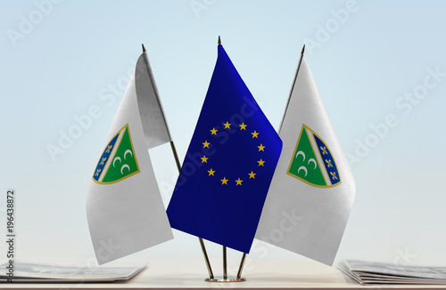 Two flags of Sanjak and European Union flag between photo