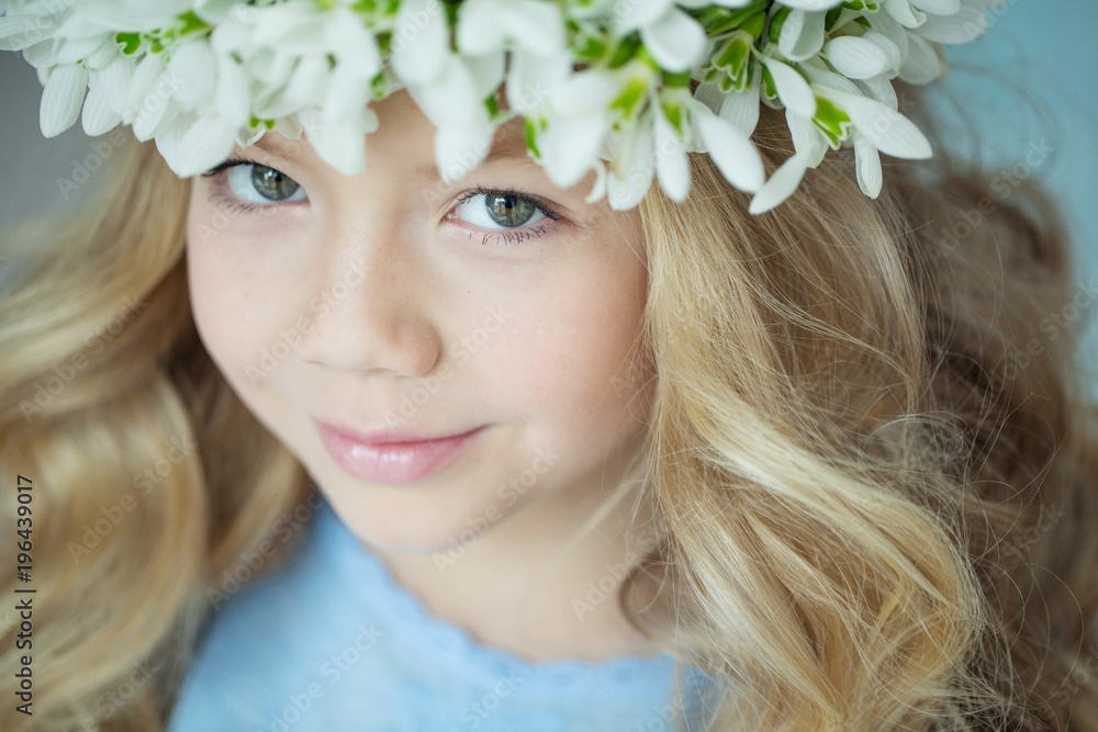 Fashionable girl with a wreath of flowers Fashionable girl with a wreath of flowers