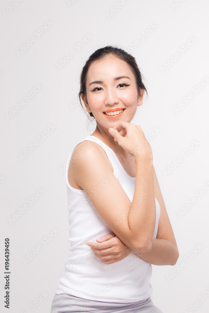 young beautiful Asian woman smile and touching her face to copy space for display product young beautiful Asian woman smile and touching her face to copy space for display product