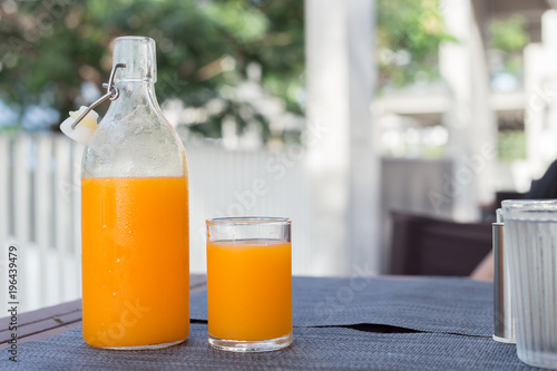 Orange juice in glass bottle