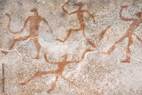 image of ancient people on the wall of the cave ocher. history. archeology.