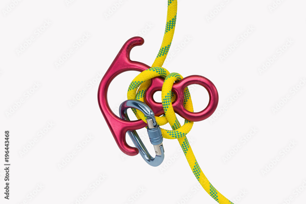 Climbing tools ,top view.Climber gears safety rope knot figure eight and carabiner used for mountain climber, tree climber or professional high rise building cleaner ,isolated white background. Climbing tools ,top view.Climber gears safety rope knot figure eight and carabiner used for mountain climber, tree climber or professional high rise building cleaner ,isolated white background.