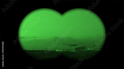 Airplane landing in the dark with the view of a night scope