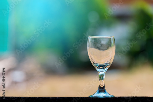 Empty wine glass on blurred background