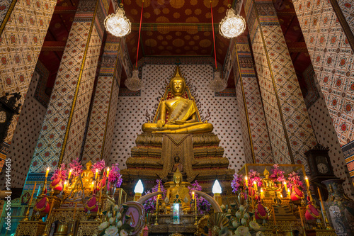 Inside the temple of Wat Arun Ratchawararam showing the image of golden Buddha