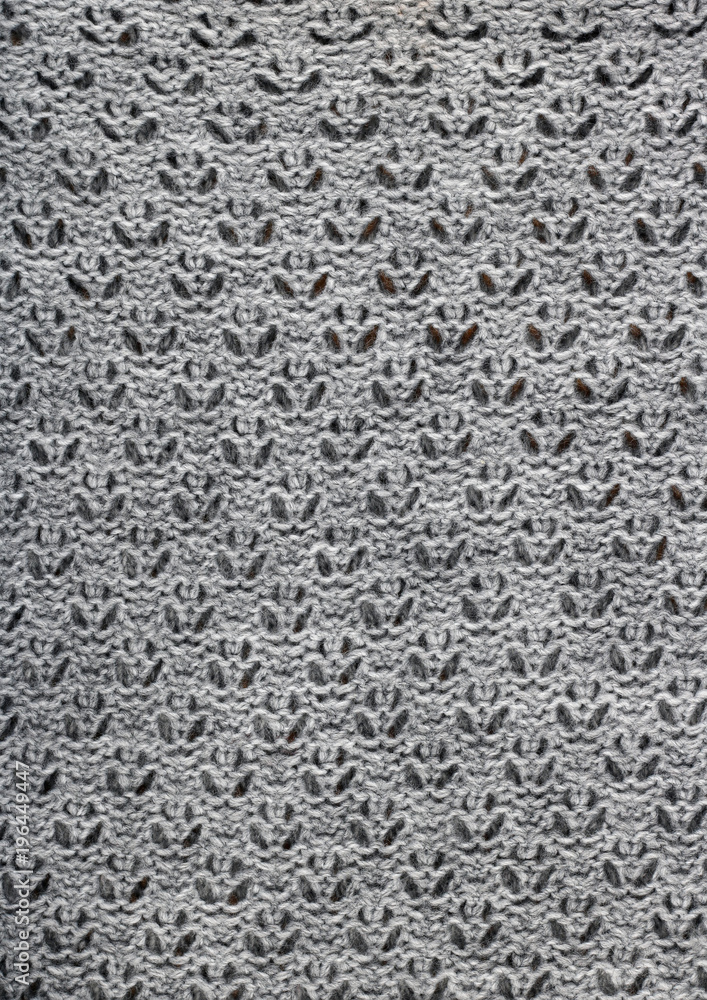 The handmade sweater is tied with thick gray suture threads. The handmade sweater is tied with thick gray suture threads.