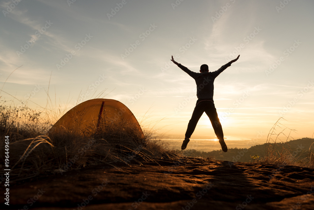 Fototapeta premium Silhouette hiker on sunrise mountain in Thailand