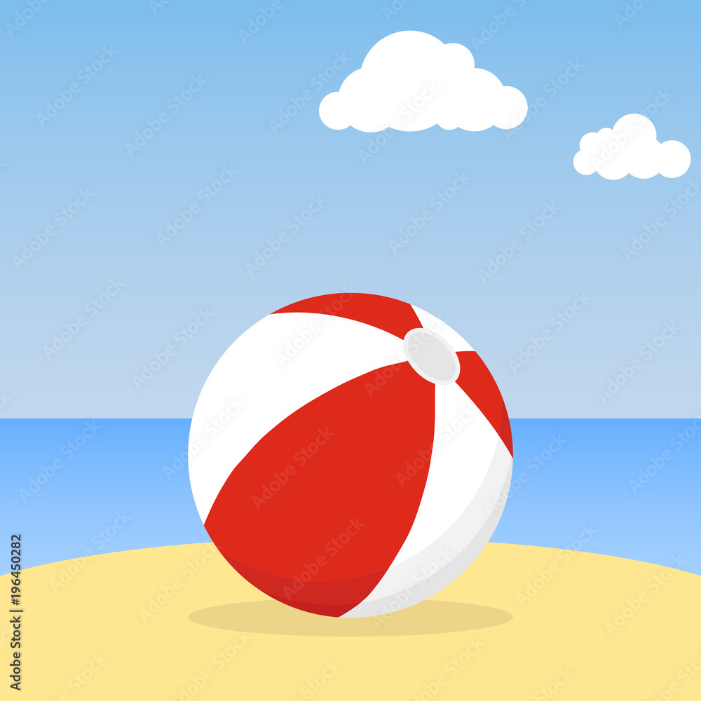 Beach ball lying in the sand. Beach ball against the blue sky.