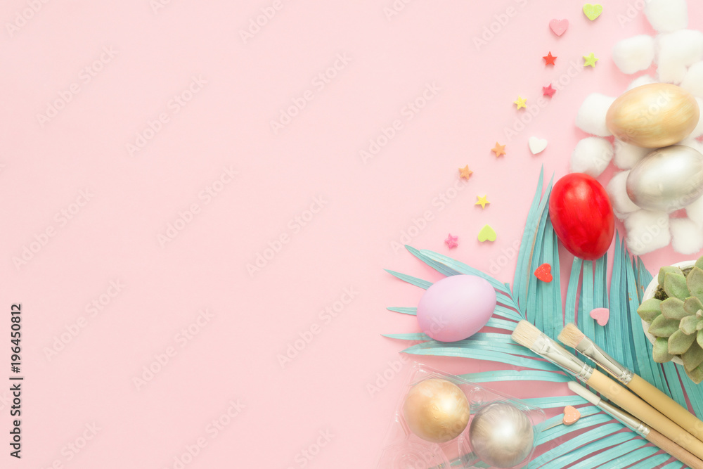 Flat lay top view colorful easter egg painted in pastel colors composition with paint brush on pink pastel color background. Easter day background top view with copy space. Flat lay top view colorful easter egg painted in pastel colors composition with paint brush on pink pastel color background. Easter day background top view with copy space.