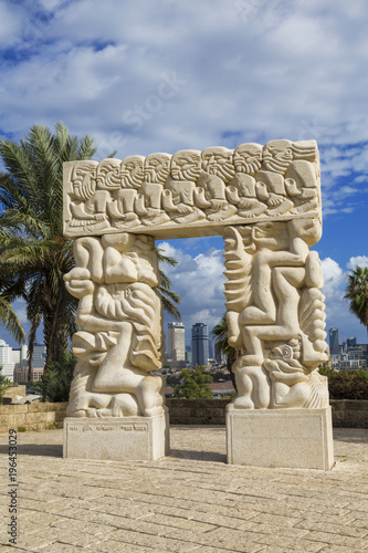 Sculpture  A belief gate  in Abrasha park in Yaffo with overlooking Tel Aviv in the background  Israel