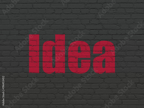 Marketing concept: Painted red text Idea on Black Brick wall background